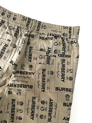 Burberry All Over Brand Name Print Beige Shorts