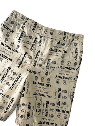 Burberry All Over Brand Name Print Beige Shorts