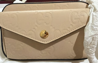 Gucci Beige GG Embossed Crossbody